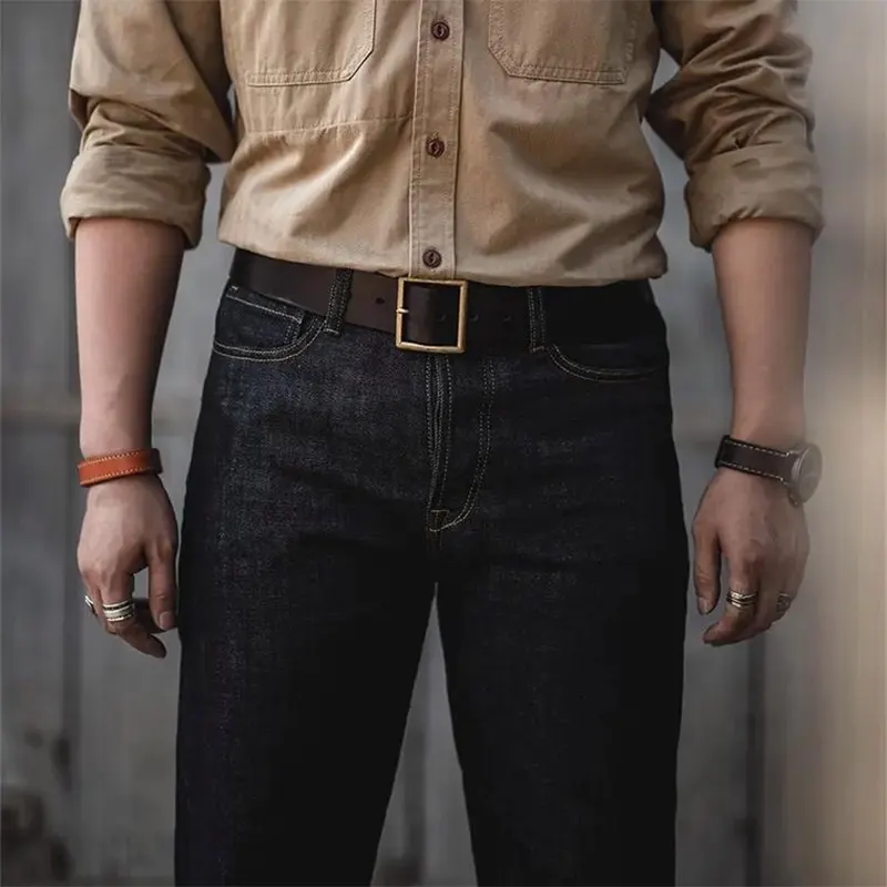 man wearing rugged leather belt and watch strap